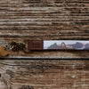 Keychain with landscape design on a wooden surface