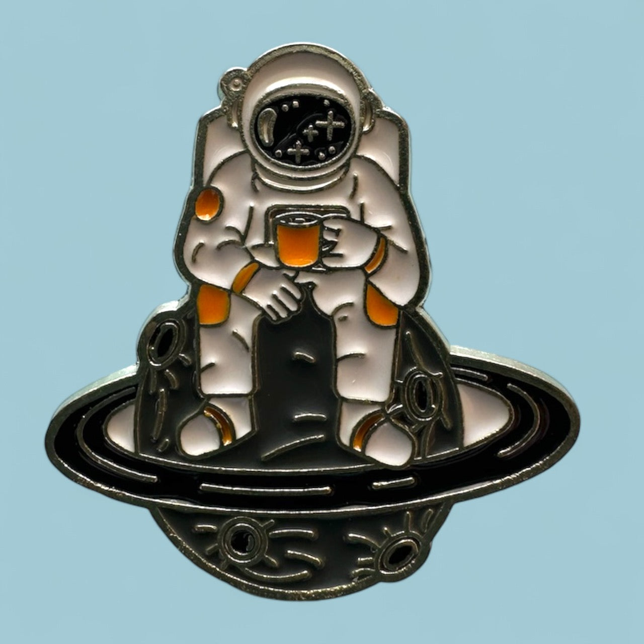 Cosmic Astronaut sitting on Saturn Enamel Pin pin Magnifique Hearts   