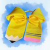 Yellow bow shaped like a pencil with a pink base 